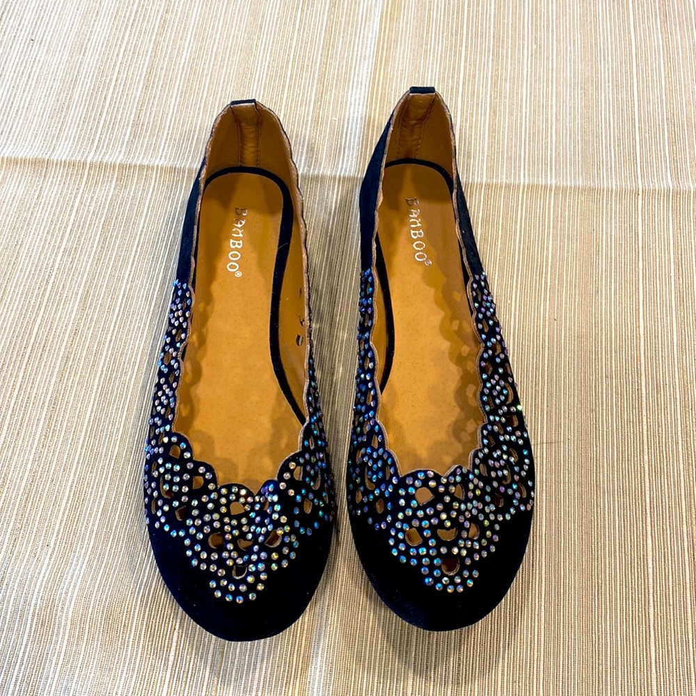 Sprakly and feminine black slip ons.